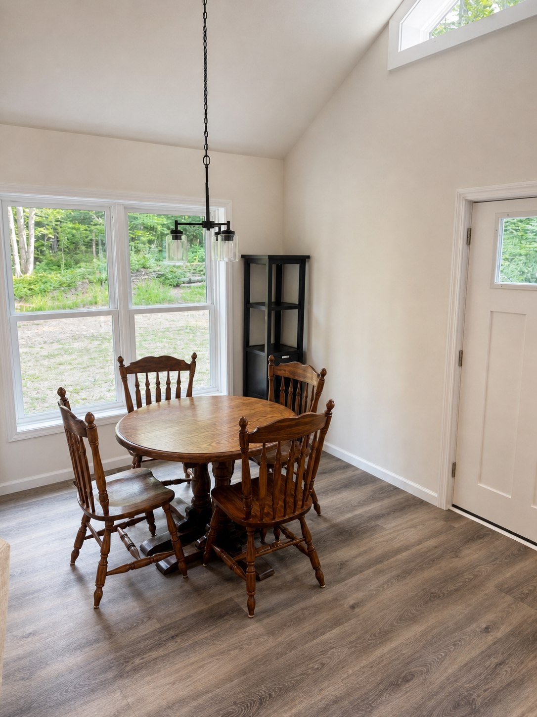 Dining area beneath the vaulted ceiling at Wild Cherry Lodge
