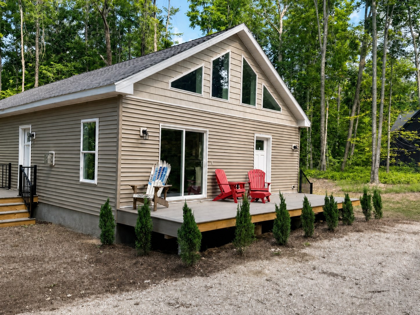 Wild Cherry Lodge exterior and deck in a wooded Harbor Springs setting